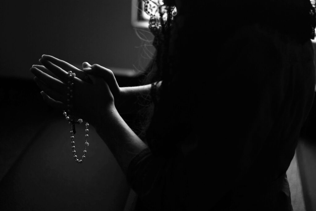 Woman in Black with Rosary